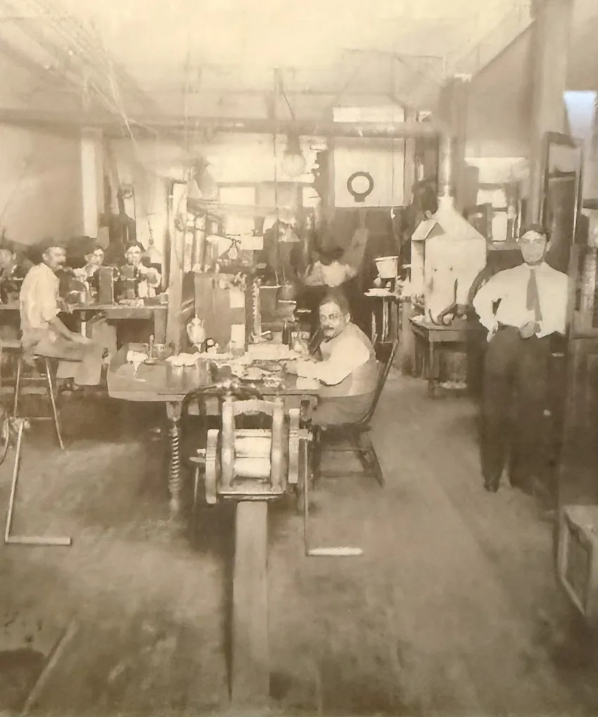 Vintage photo of a jewelry workshop with craftsmen at work, early 20th century.