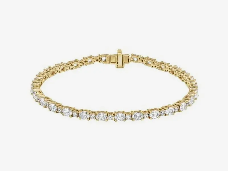 Gold bracelet with round diamonds in a tennis style.