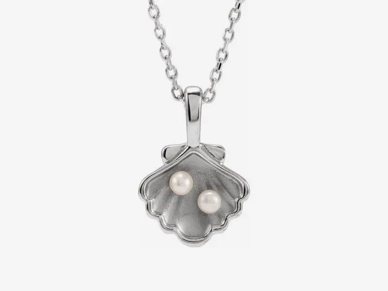 Silver shell pendant with two pearls on a chain from Stephen's Fine Jewelry.