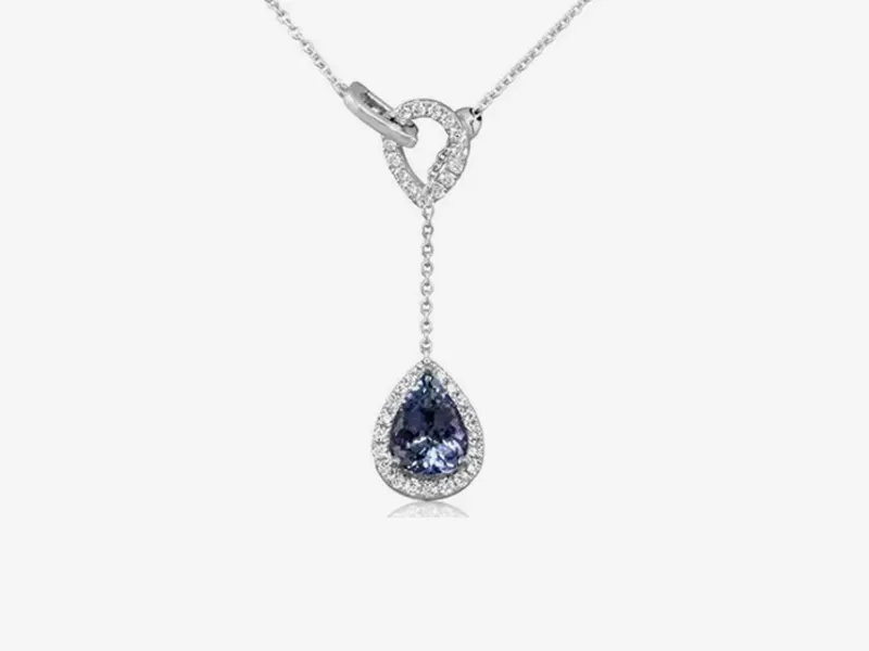Elegant necklace with a heart-shaped loop and teardrop blue gemstone pendant.