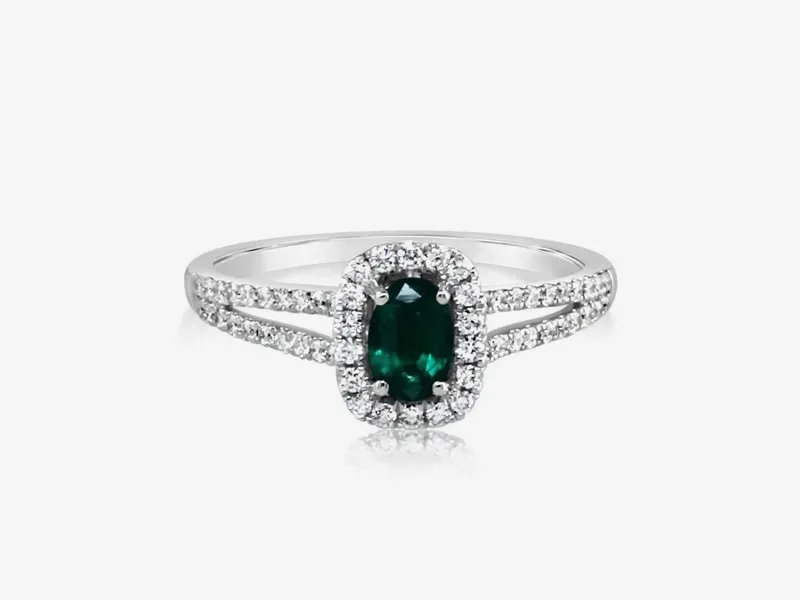 A silver ring with a green gemstone and diamond accents from Stephen's Fine Jewelry.