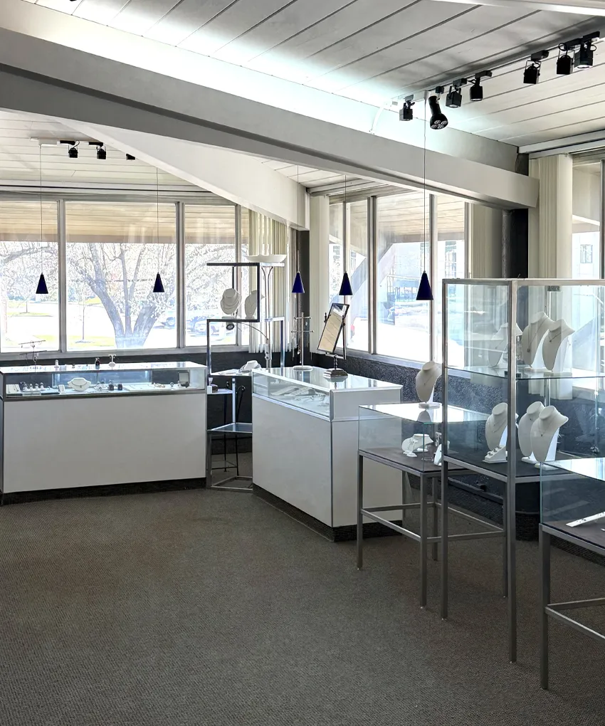 Interior of Stephen's Fine Jewelry store with display cases and mannequins in Leawood, KS.