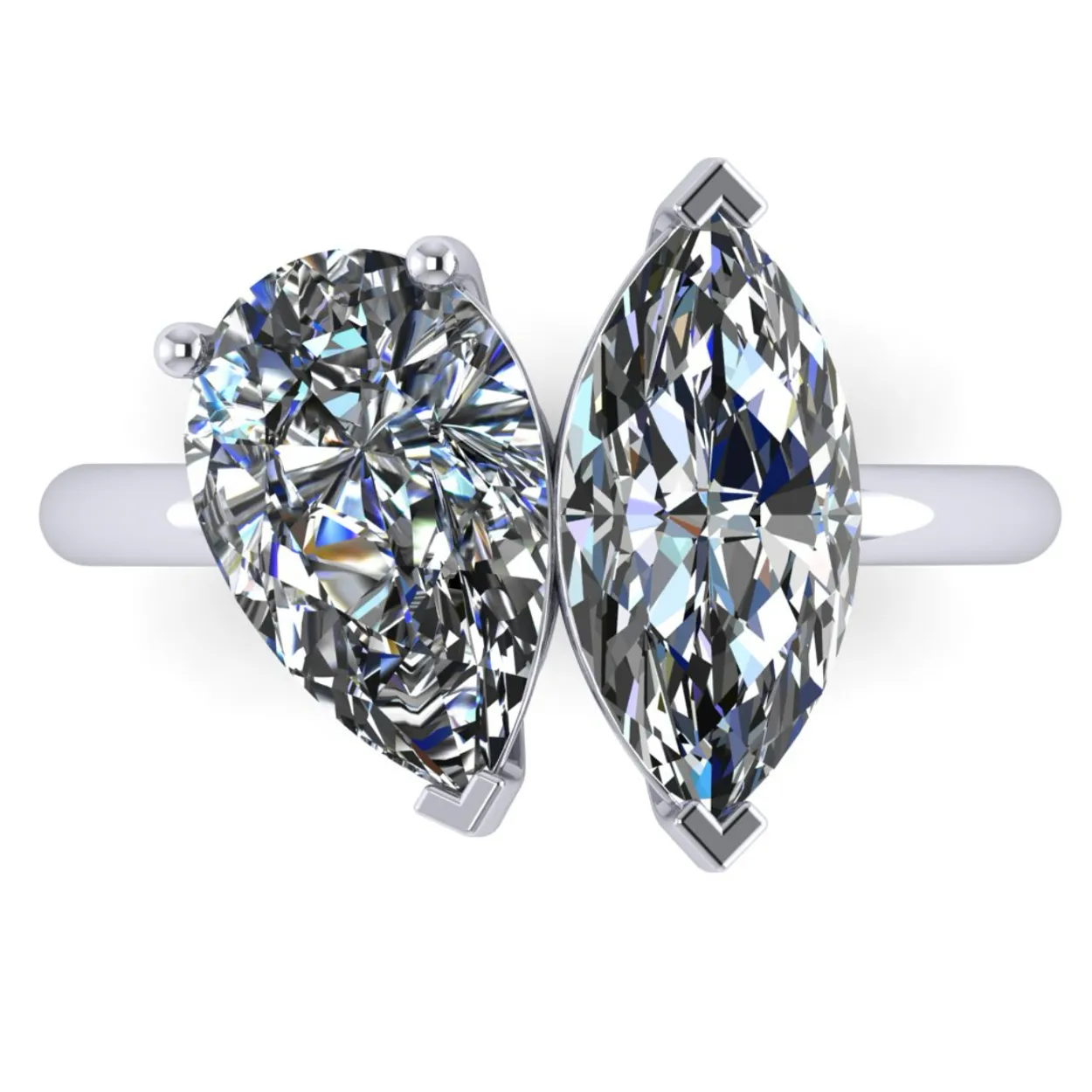 Two-stone diamond ring with pear and marquise cuts on a silver band.