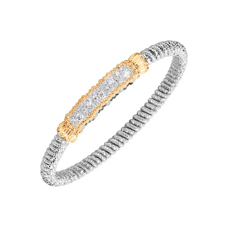 Elegant silver and gold bracelet with diamond accents. 