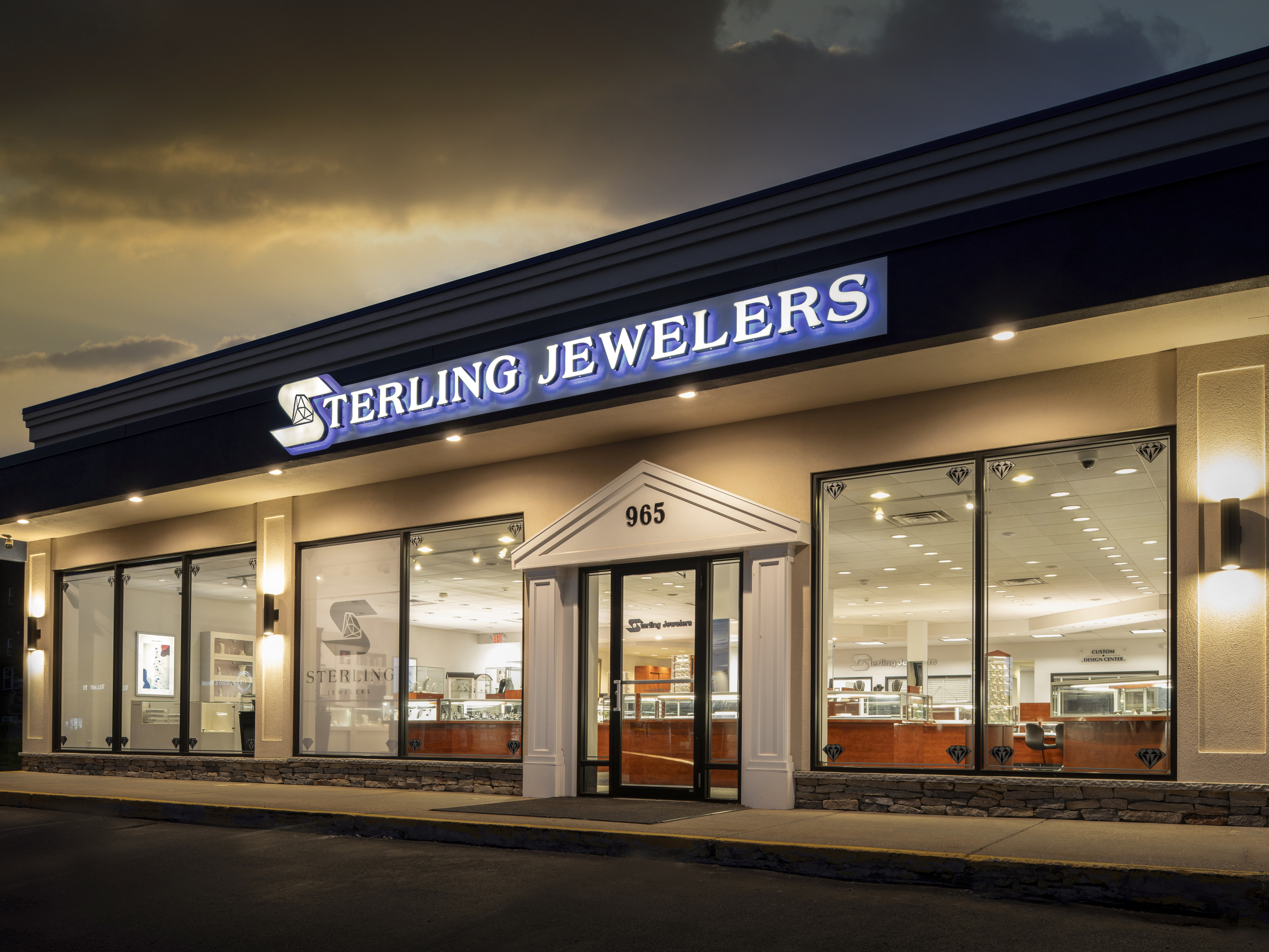Sterling Jewelers storefront at night, showcasing fine jewelry and engagement rings in Wethersfield.
