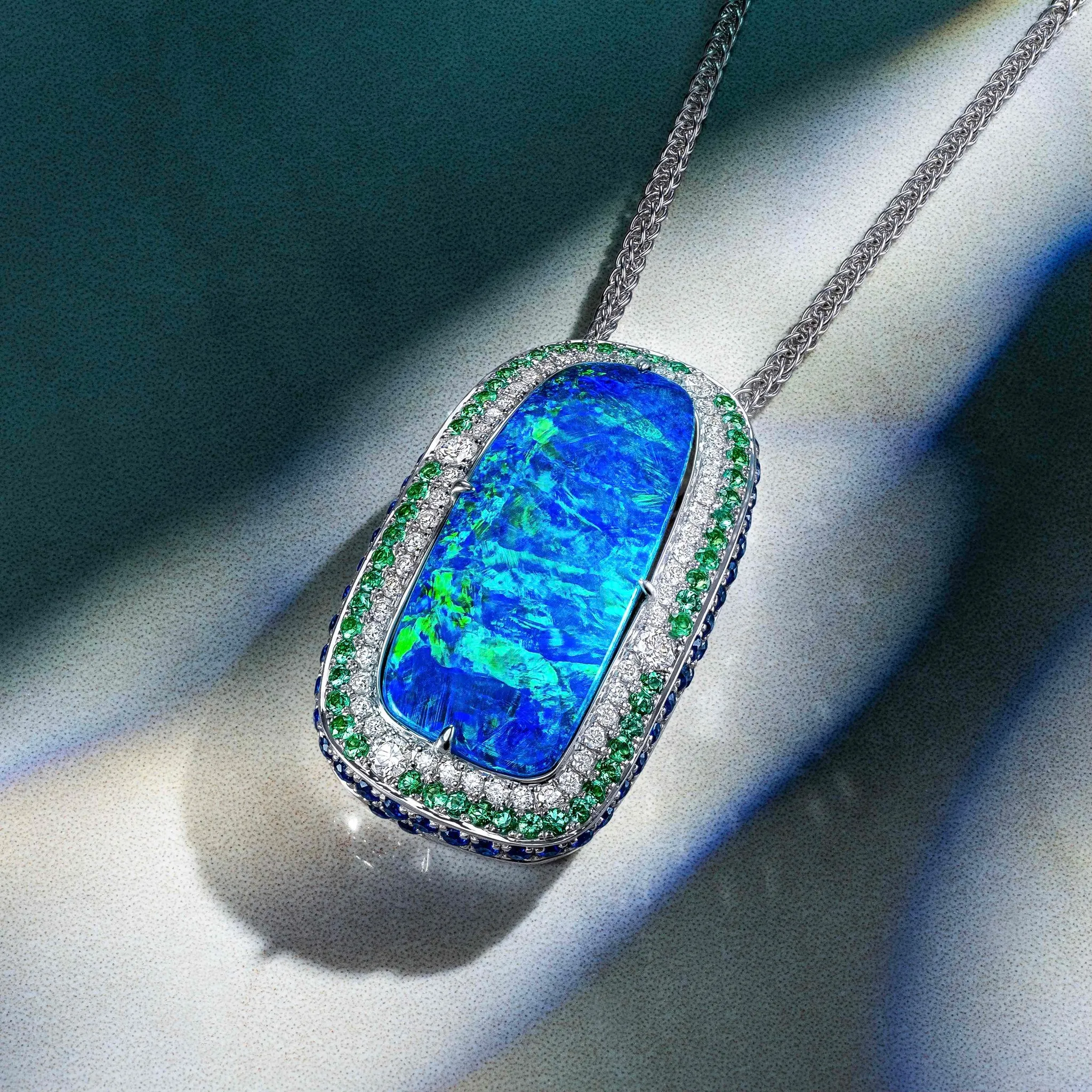 Jeweler crafting a custom ring with tweezers, showcasing intricate details in a workshop setting.