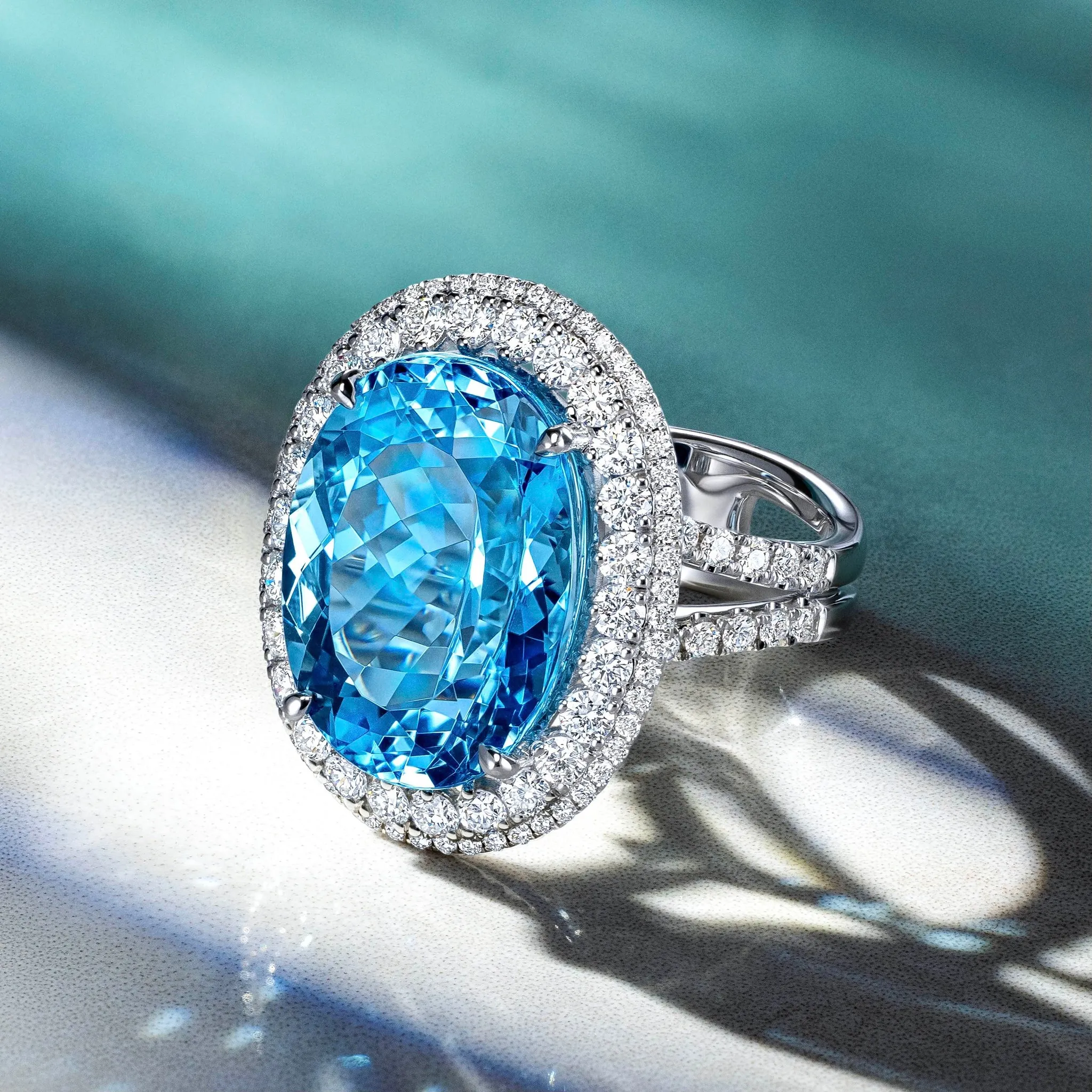 Jeweler using tweezers to work on a small gemstone, showcasing craftsmanship in jewelry design.