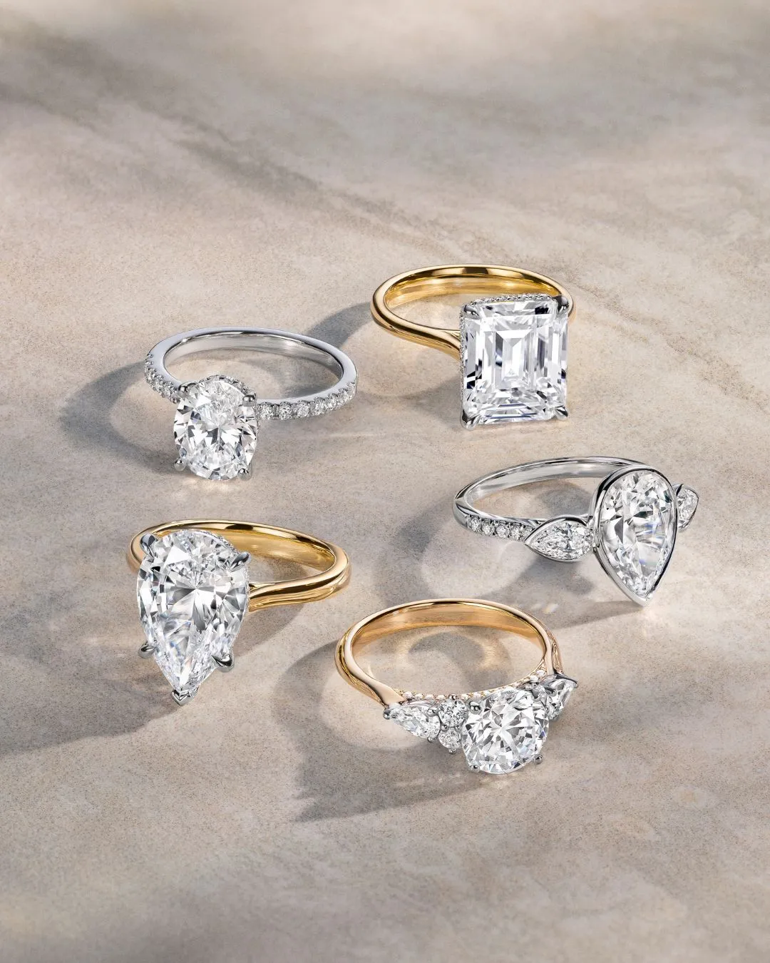 Elegant woman showcasing a diamond engagement ring and earrings.