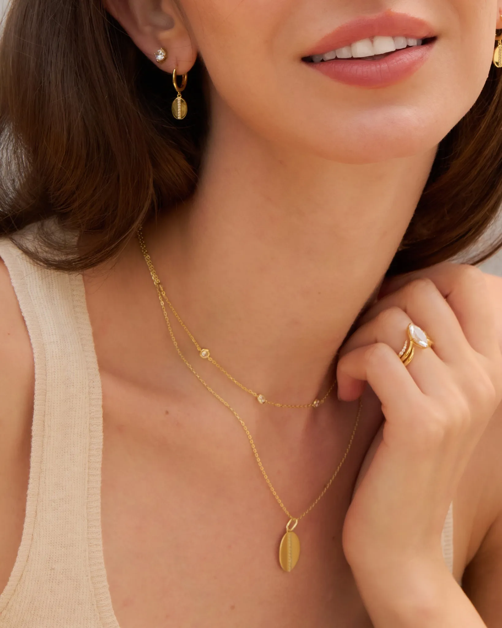 Emerald-cut green gemstone ring set in gold, featured in Sterling Jewelers' gifts under $500.