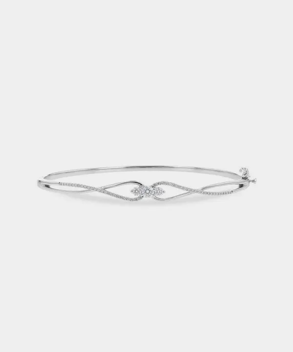 Elegant silver bracelet with a diamond knot design, perfect for special occasions.