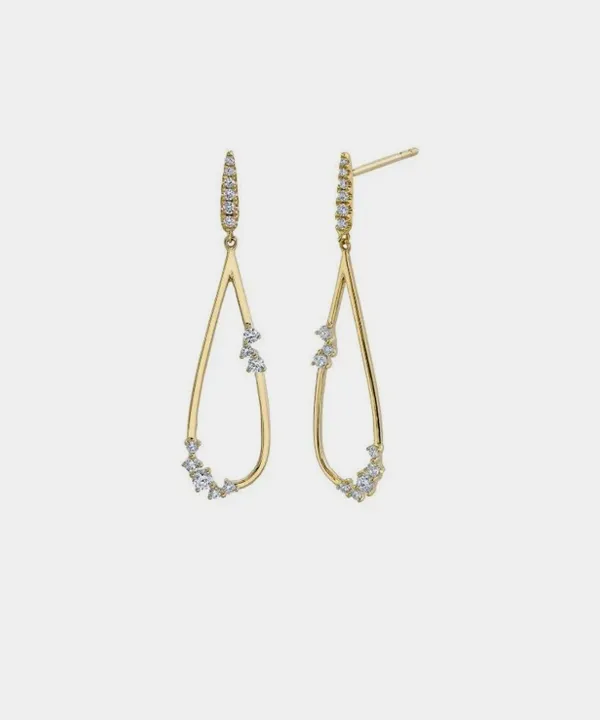 Elegant gold earrings with a teardrop design, adorned with sparkling diamonds.
