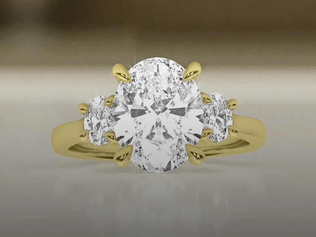 Elegant diamond engagement ring with intricate detailing, displayed on a marble surface.