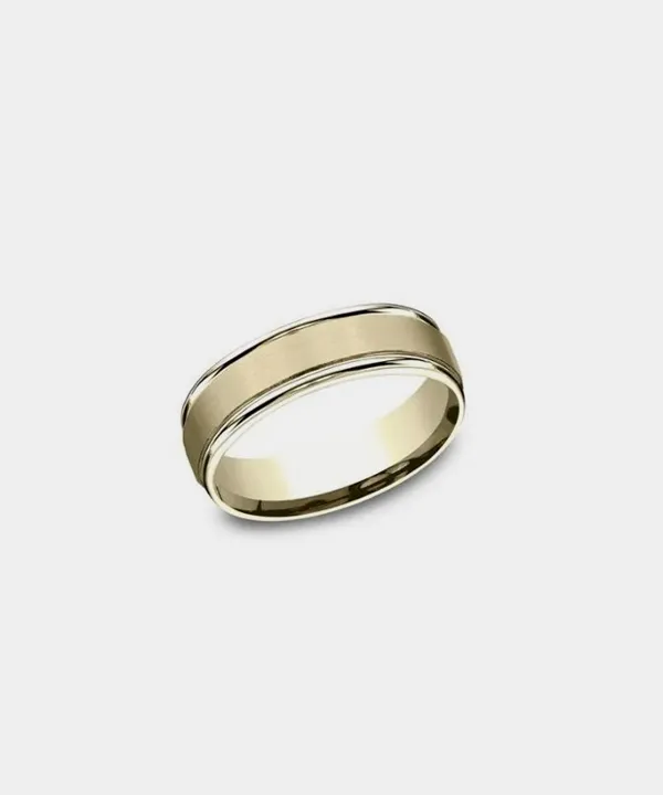 Men's gold wedding band with a polished finish and subtle grooves, displayed on a white background.