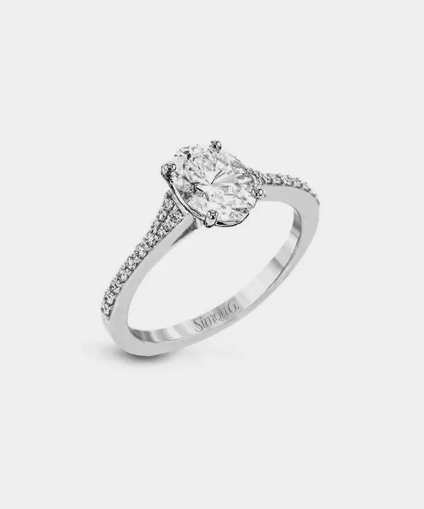 Elegant oval diamond engagement ring with pave-set diamonds on the band.