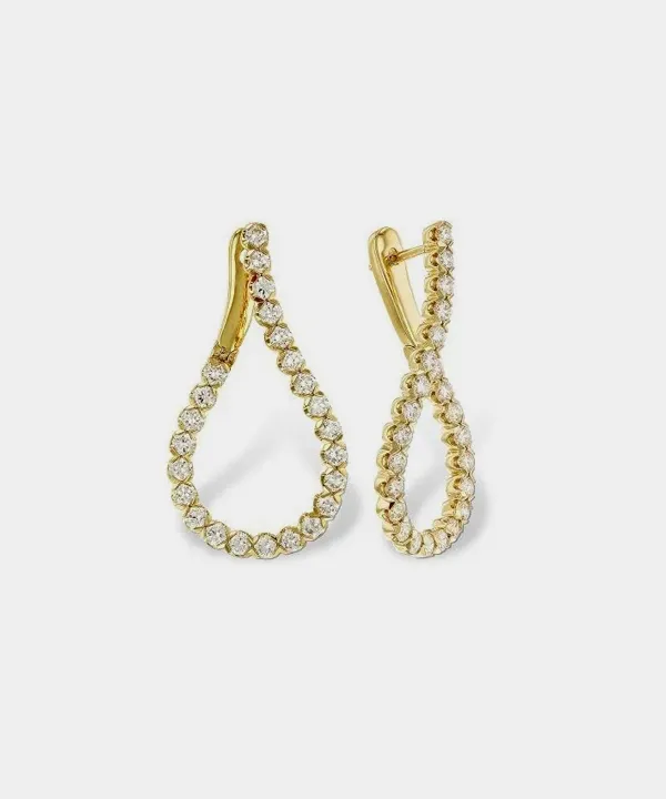 Gold teardrop earrings adorned with sparkling crystals, perfect for adding elegance to any outfit.