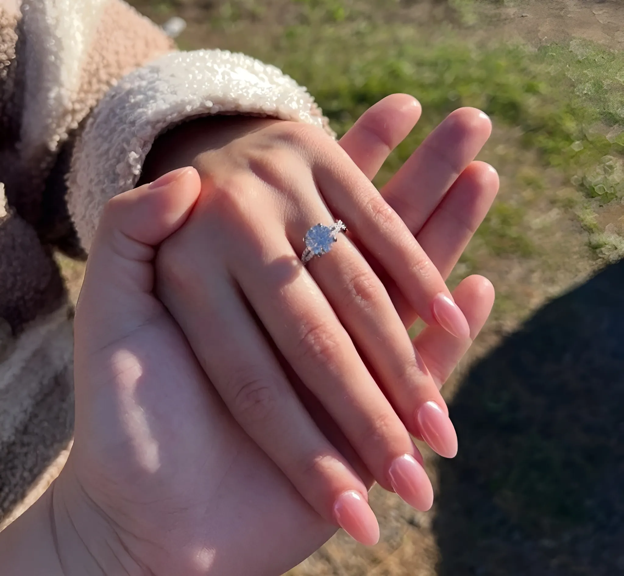 Three elegant diamond rings in rose gold, white gold, and yellow gold, showcasing sparkling stones.