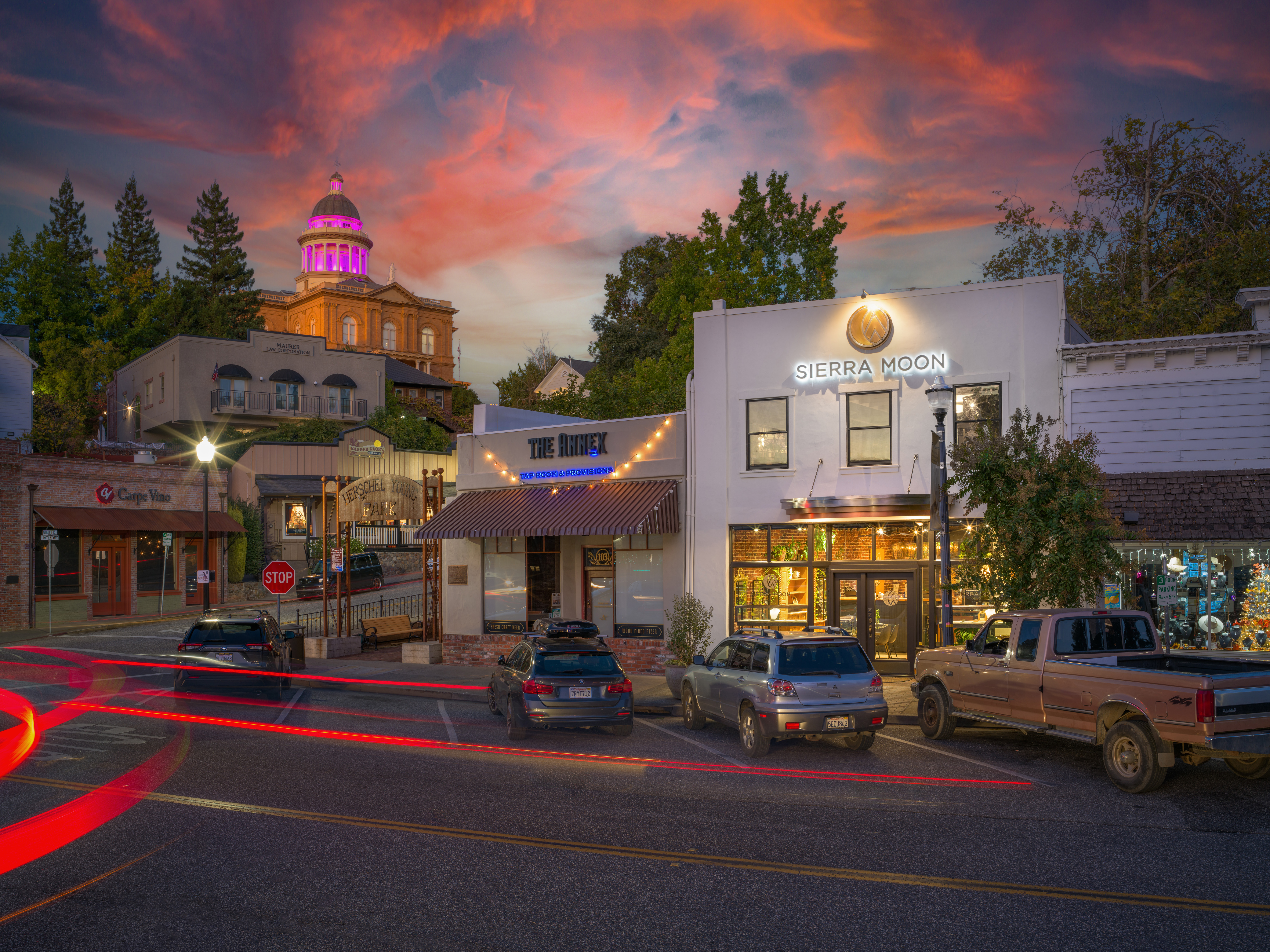 A sparkling diamond on a soft surface, casting a shadow, representing fine jewelry from Sierra Moon in Auburn.