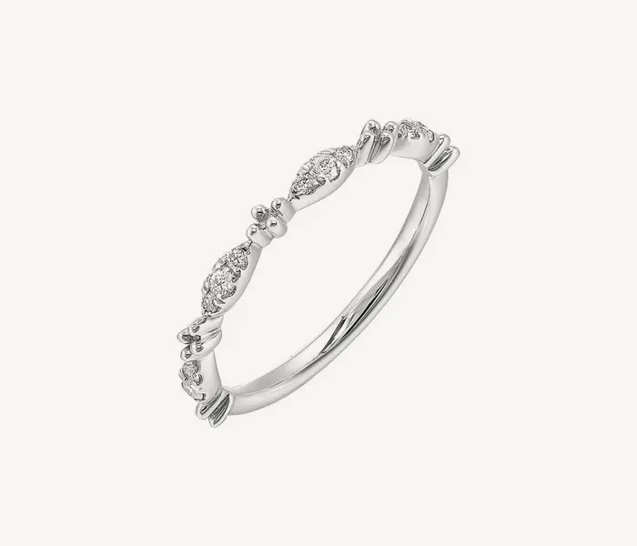 Delicate silver ring with diamond accents, perfect for engagement or stacking.