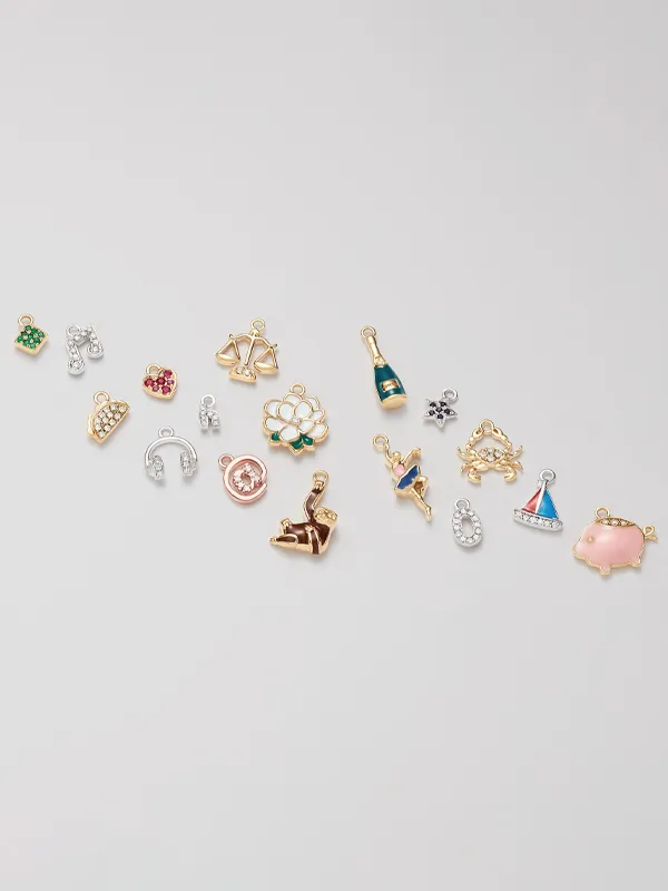 Colorful assortment of charms including flowers, scales, and animals, perfect for jewelry customization. Click to explore!
