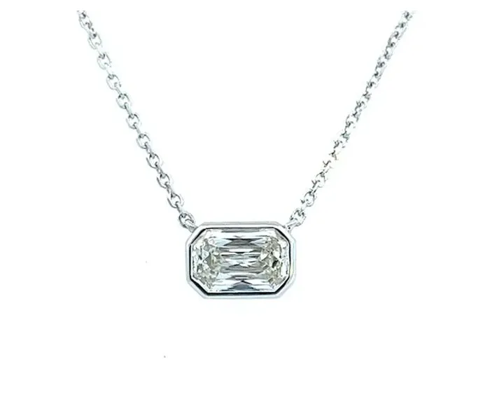 Elegant octagonal diamond pendant necklace on a silver chain.