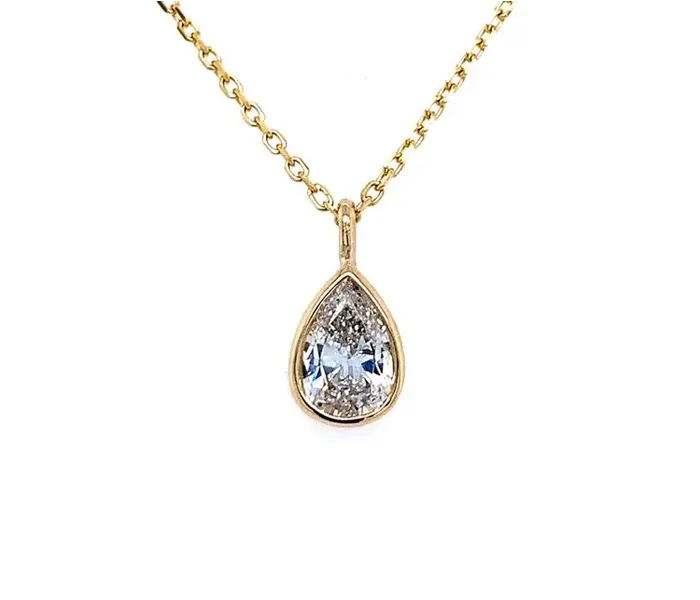 Gold chain necklace featuring a pear-shaped diamond pendant.