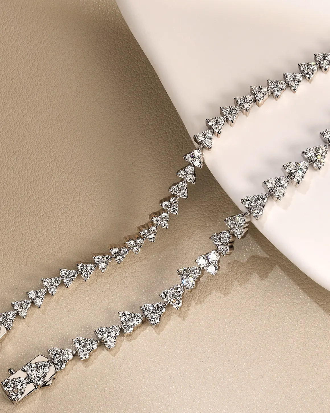Diamond triangle bracelet displayed elegantly on a neutral background. Click to Shop Now at Synder Jewelers in Longmont.