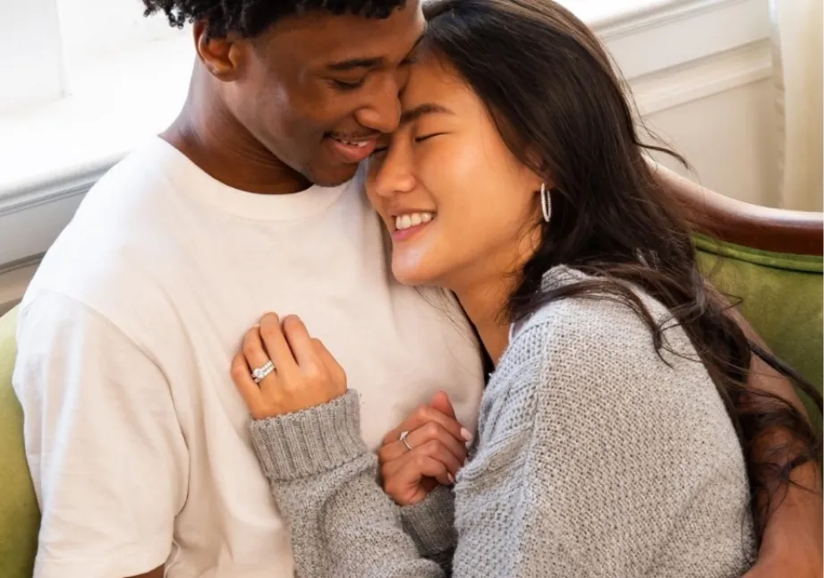 Newly engaged couple cherishing the moment of wearing a Fana engagement ring from Stuart Benjamin & Co. Jewelry Designs San Dieg