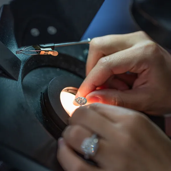 Master jeweler setting a diamond by hand at SVS Fine Jewelry — Forever Custom workshop in Oceanside, Long Island NY