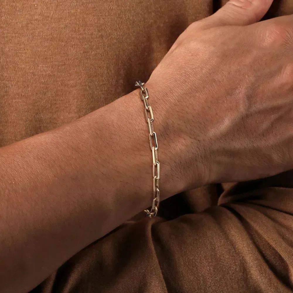Gabriel & Co. men's gold bracelet on a man's wrist, available at SVS Fine Jewelry Oceanside Long Island