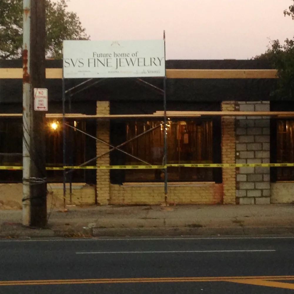 The 3323 Long Beach Road building before SVS Fine Jewelry construction began in 2013, with future home of SVS signage out front