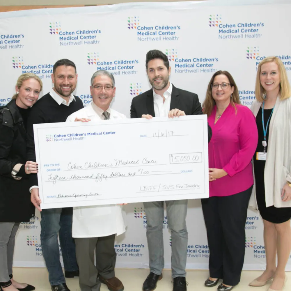SVS Fine Jewelry presenting LBIFF fundraising check for Cohen Children's Medical Center