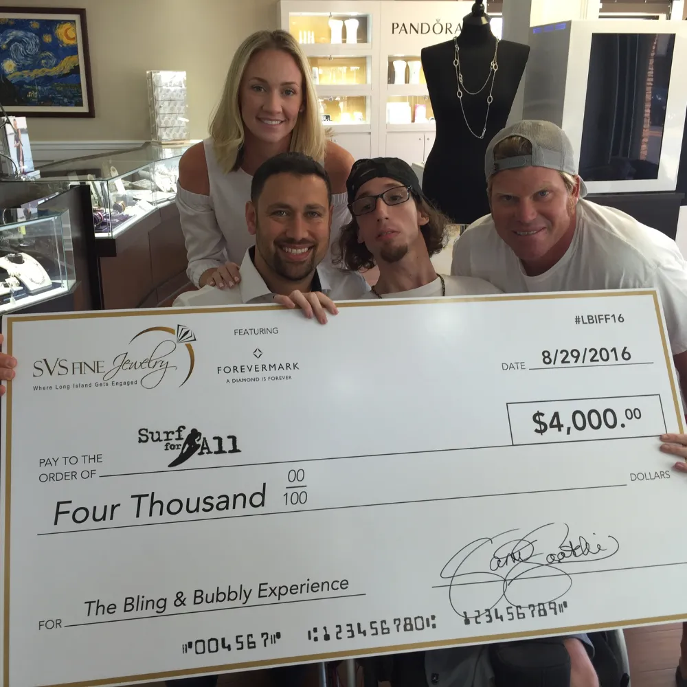 SVS Fine Jewelry donation check to Surf for All in 2016