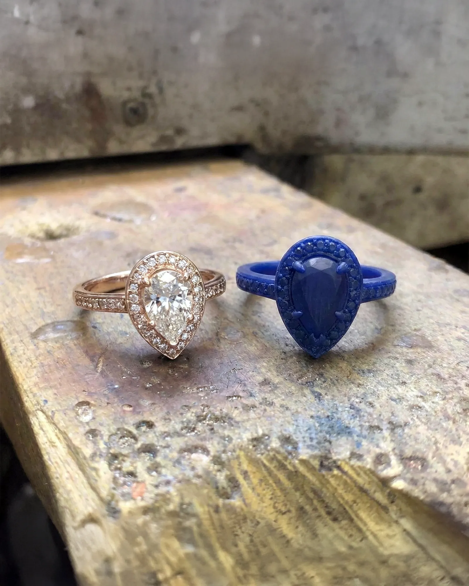 A hand sketches a jewelry design on paper, showcasing intricate details and creativity.