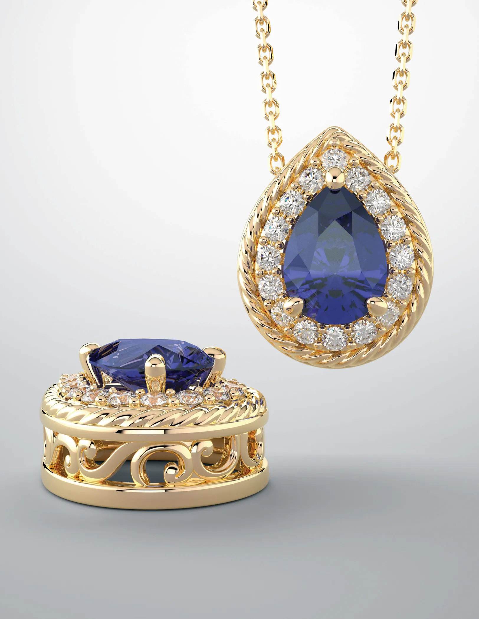 Gold pendant and ring featuring a large blue gemstone surrounded by smaller diamonds, displayed elegantly.