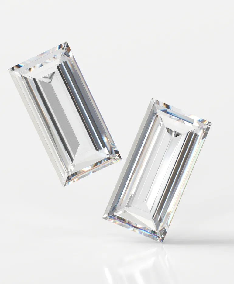 Two sparkling rectangular diamonds displayed against a white background, showcasing their clarity and brilliance.