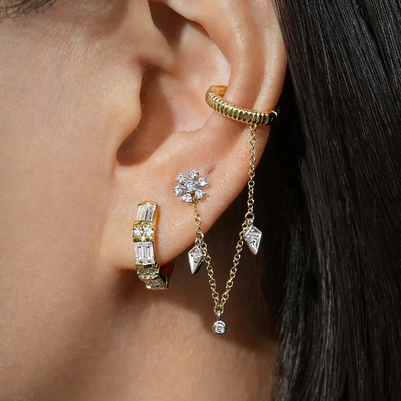 Stylish ear jewelry featuring gold and diamond accents. Click to shop now at The Diamond Shop, Inc. in Lewiston.