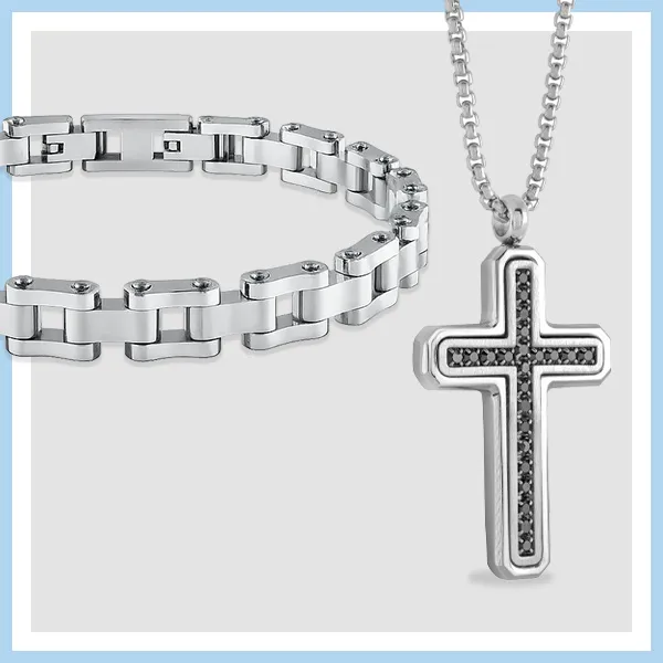 Men's stainless steel jewelry set featuring a silver link bracelet and black diamond cross pendant necklace