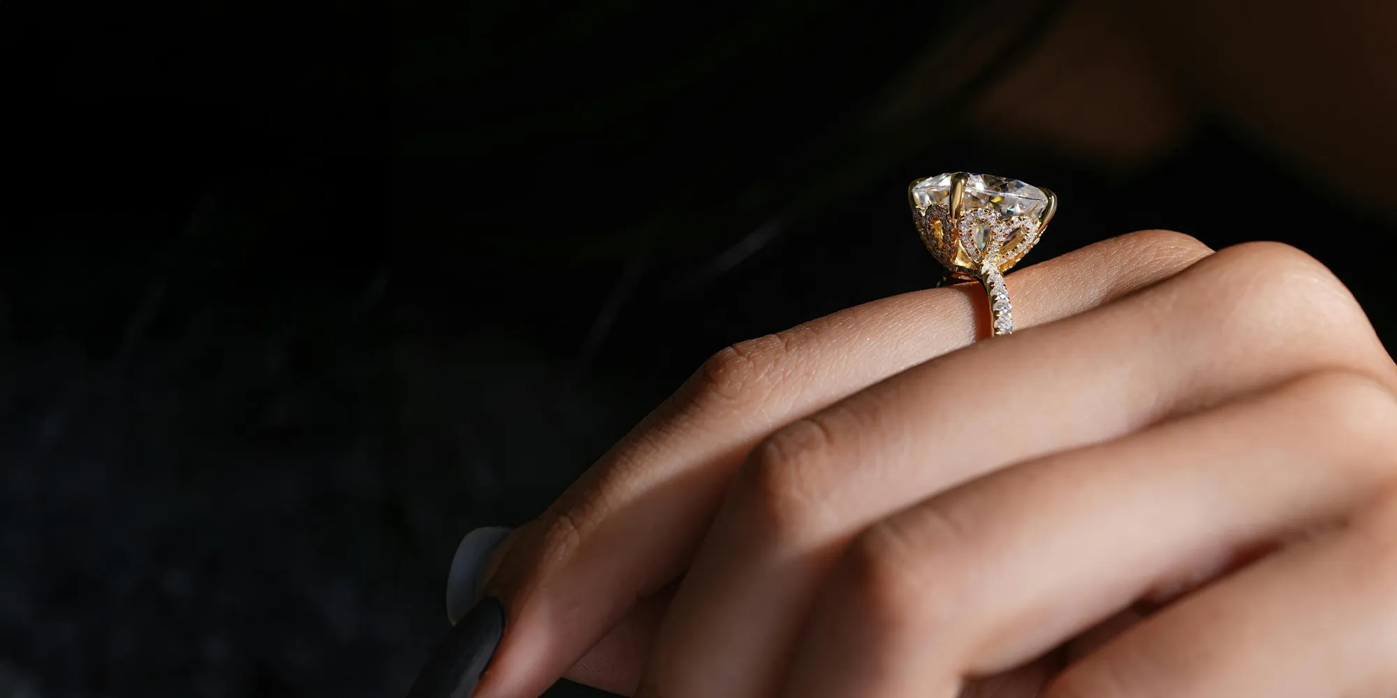 Stunning diamond engagement ring on a hand.