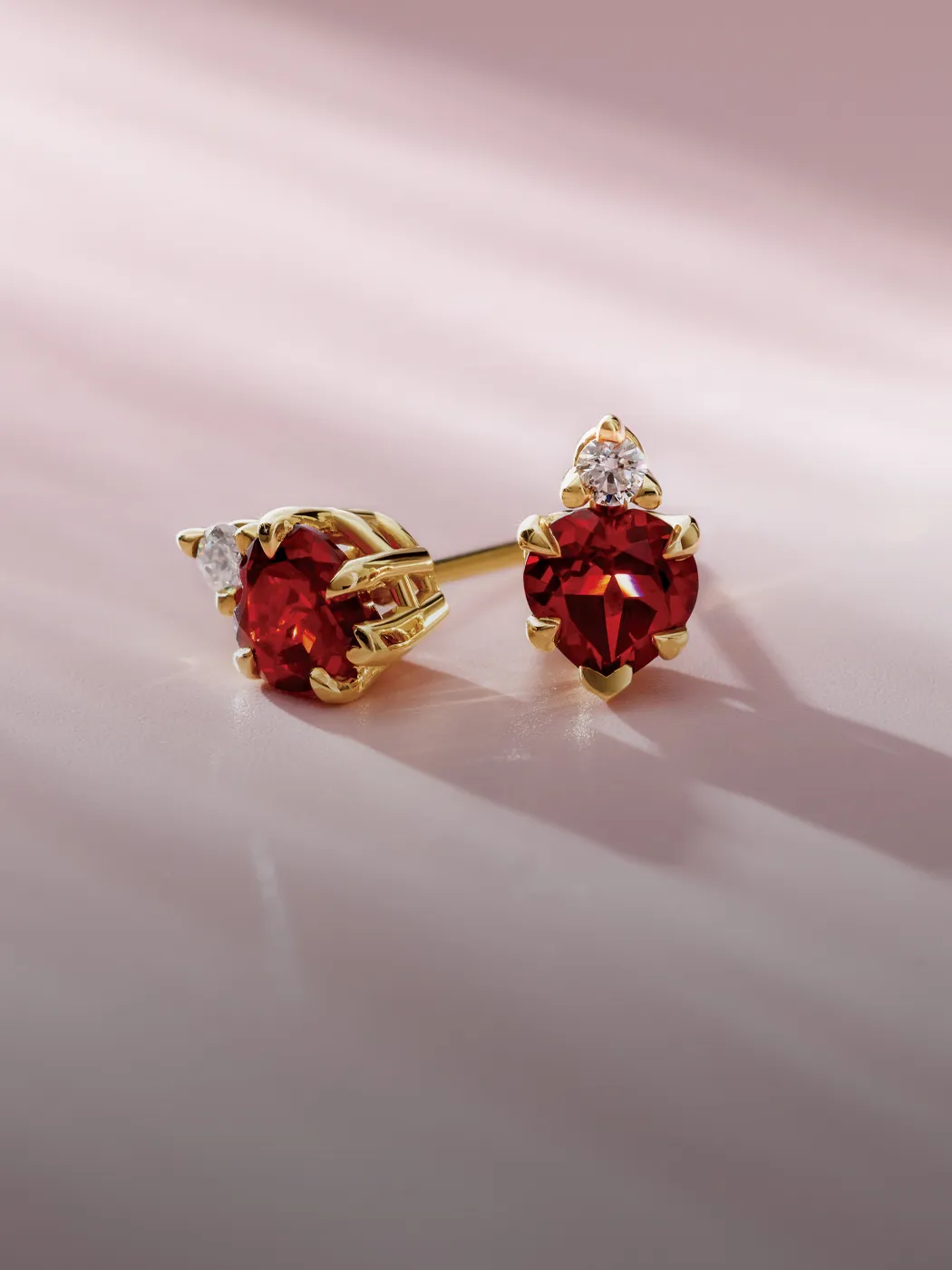 Elegant red gemstone earrings with sparkling accents, perfect for any occasion.