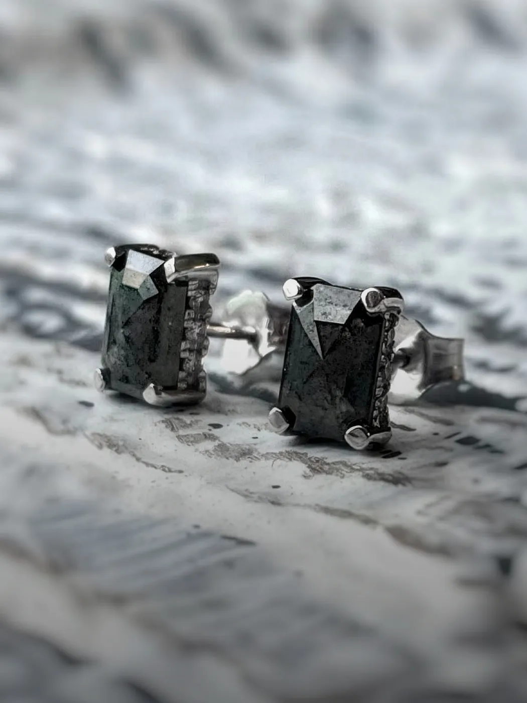 Elegant silver earrings with dark rectangular stones, perfect for any occasion.