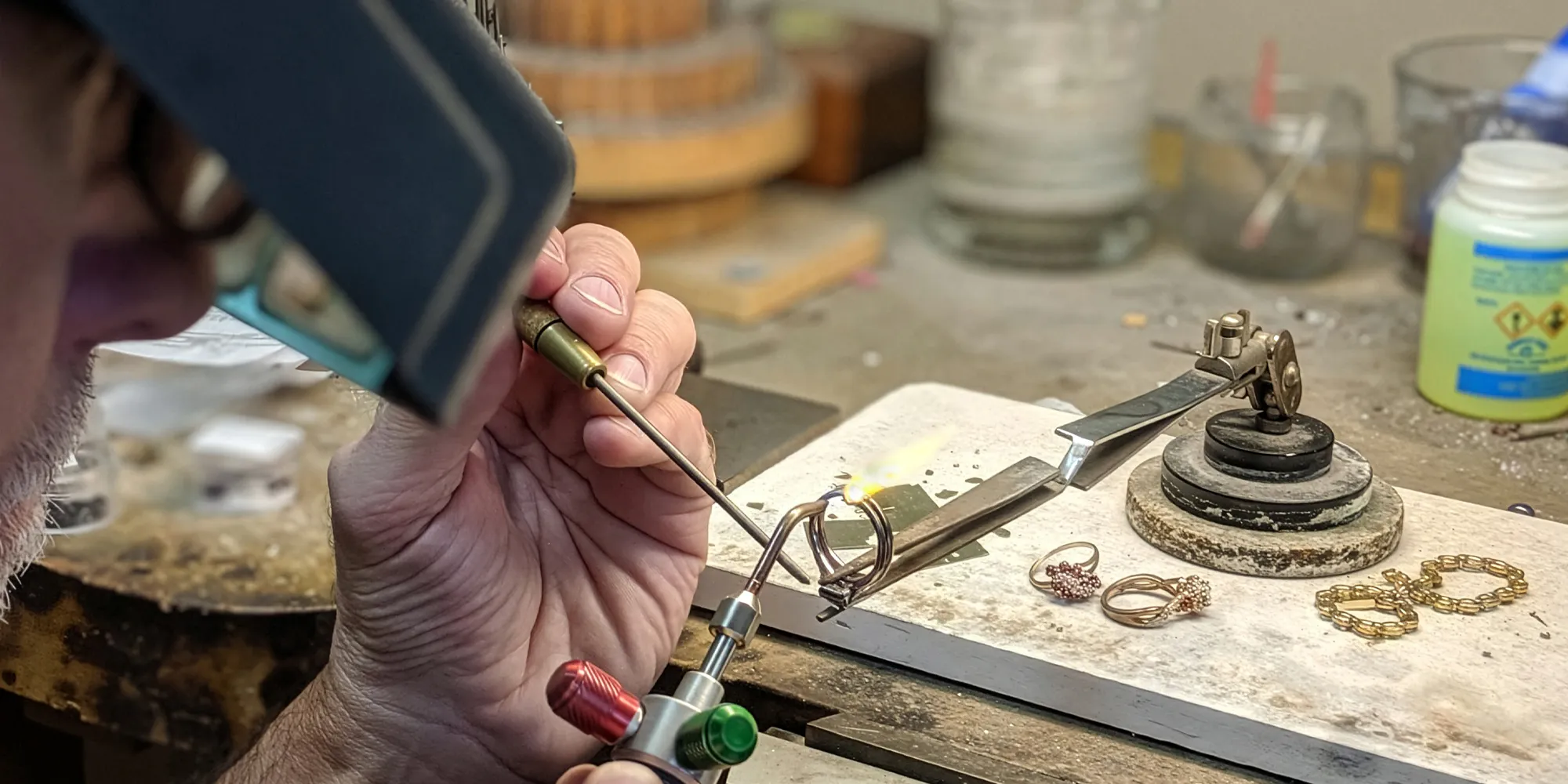 Jeweler using a torch to repair a ring at T.J.'s Fine Jewelry in Carbondale, IL.