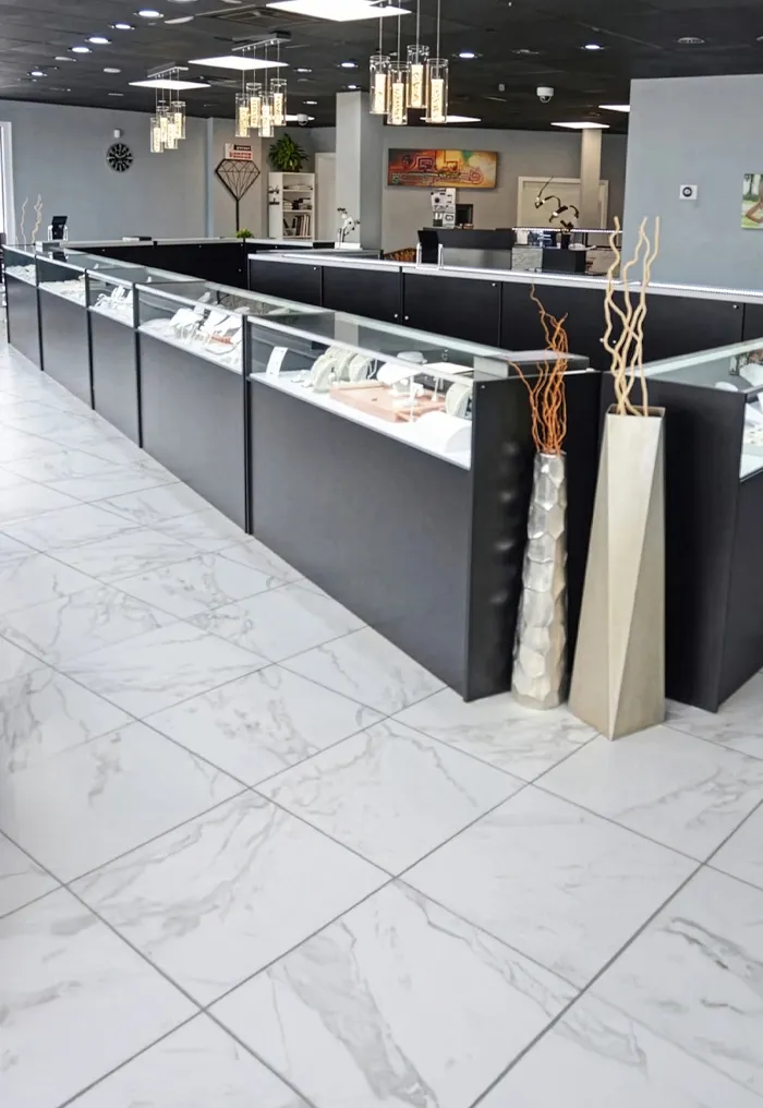 Interior of T.J.'s Fine Jewelry store in Carbondale, showcasing display cases and a modern design.