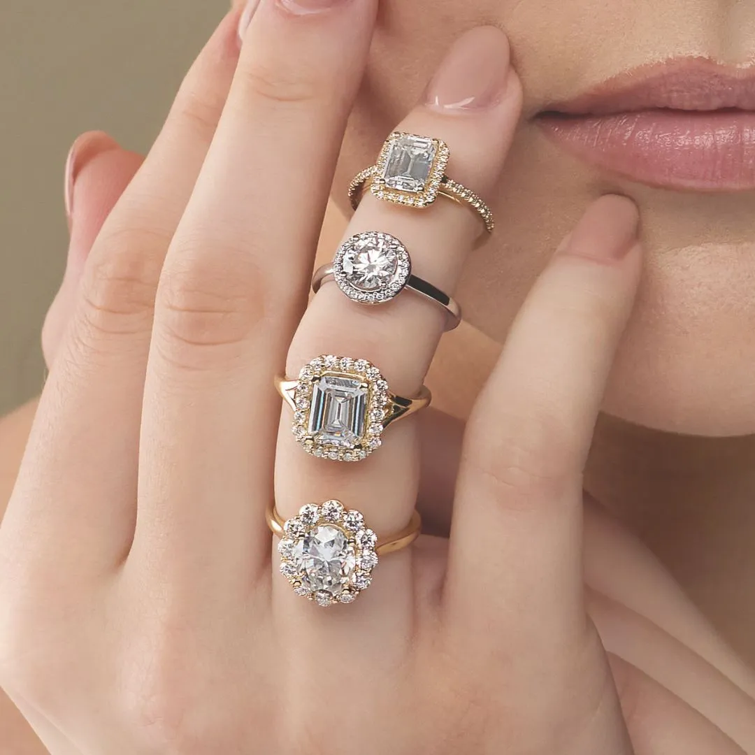Three elegant engagement rings featuring diamonds in gold and silver settings, showcasing various styles and designs.