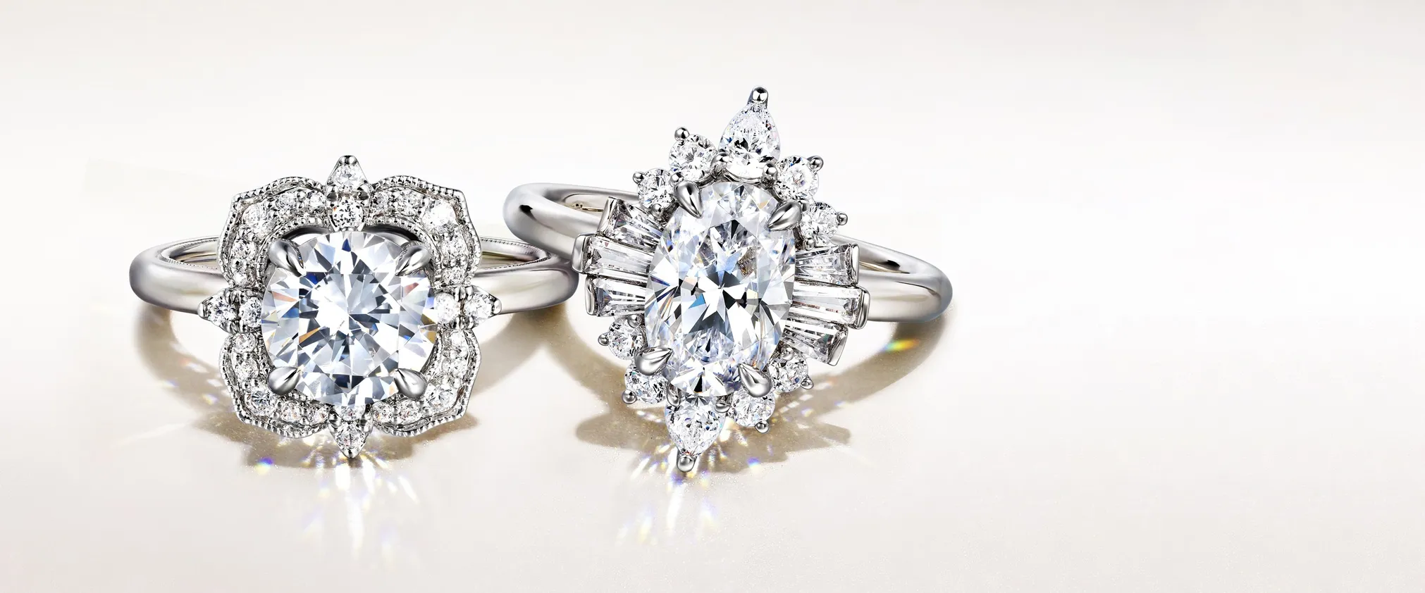 Two elegant diamond engagement rings on a light background. Click to shop engagement rings at Tom Cook Jeweler, Daytona Beach.