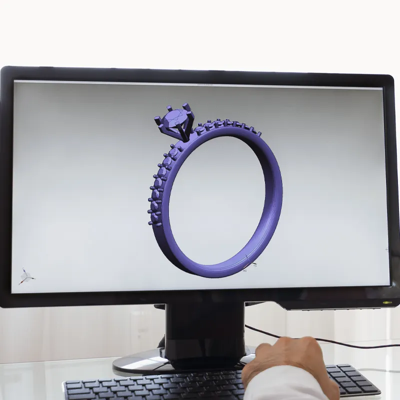 3D rendering of a purple engagement ring on a computer screen, showcasing custom jewelry design at Tom Cook Jeweler, Inc.