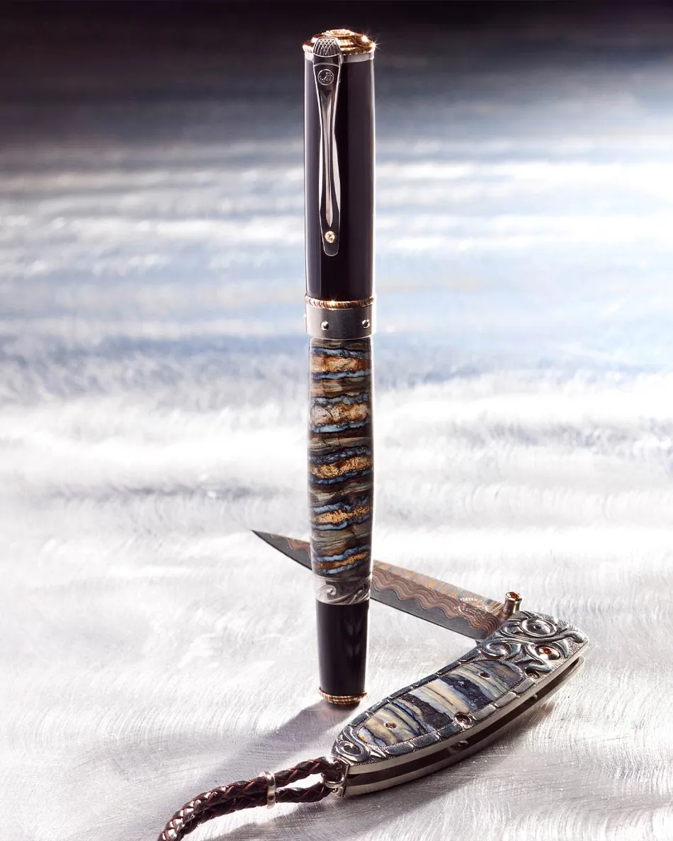 Stylish pen and knife set with intricate designs. Click to shop men's gifts at Tom Cook Jeweler, Inc.