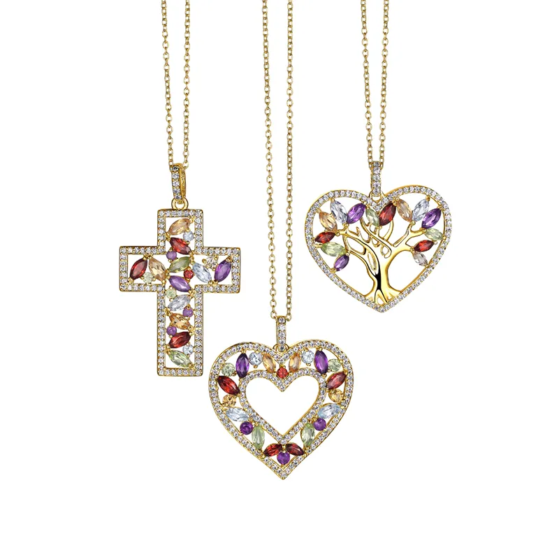 Multi-stone Pendants 18k yellow gold plated sterling silver necklaces featuring Brazilian amethyst, sky blue topaz, citrine, garnet, and peridot in a stylish cross, open heart, or tree designs. The Plumb Club CHARLOTTE, AL