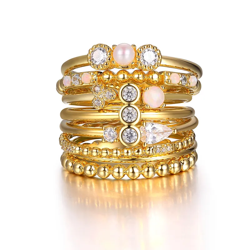 18k Gold-plated Stacking Rings Elevate your style with our 18k yellow gold plated sterling silver stacking rings. Featuring plain and textured bands with created opal accents. The Plumb Club CHARLOTTE, AL