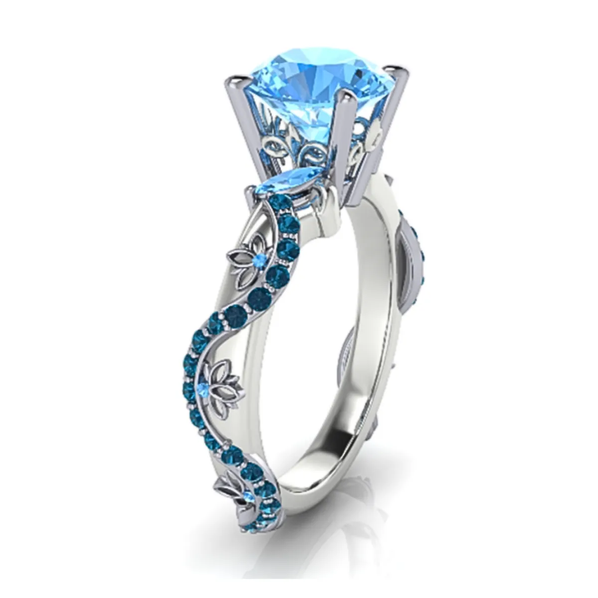 Elegant white gold engagement ring with a blue gemstone intricate floral designs. Visit Masterpiece Jewelers in Daytona Bch