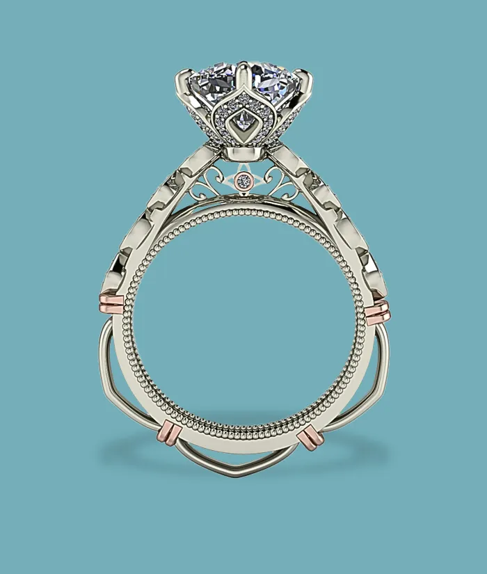 Elegant engagement ring with a large diamond and intricate design, featuring rose gold accents. Visit Masterpiece Jewelers.